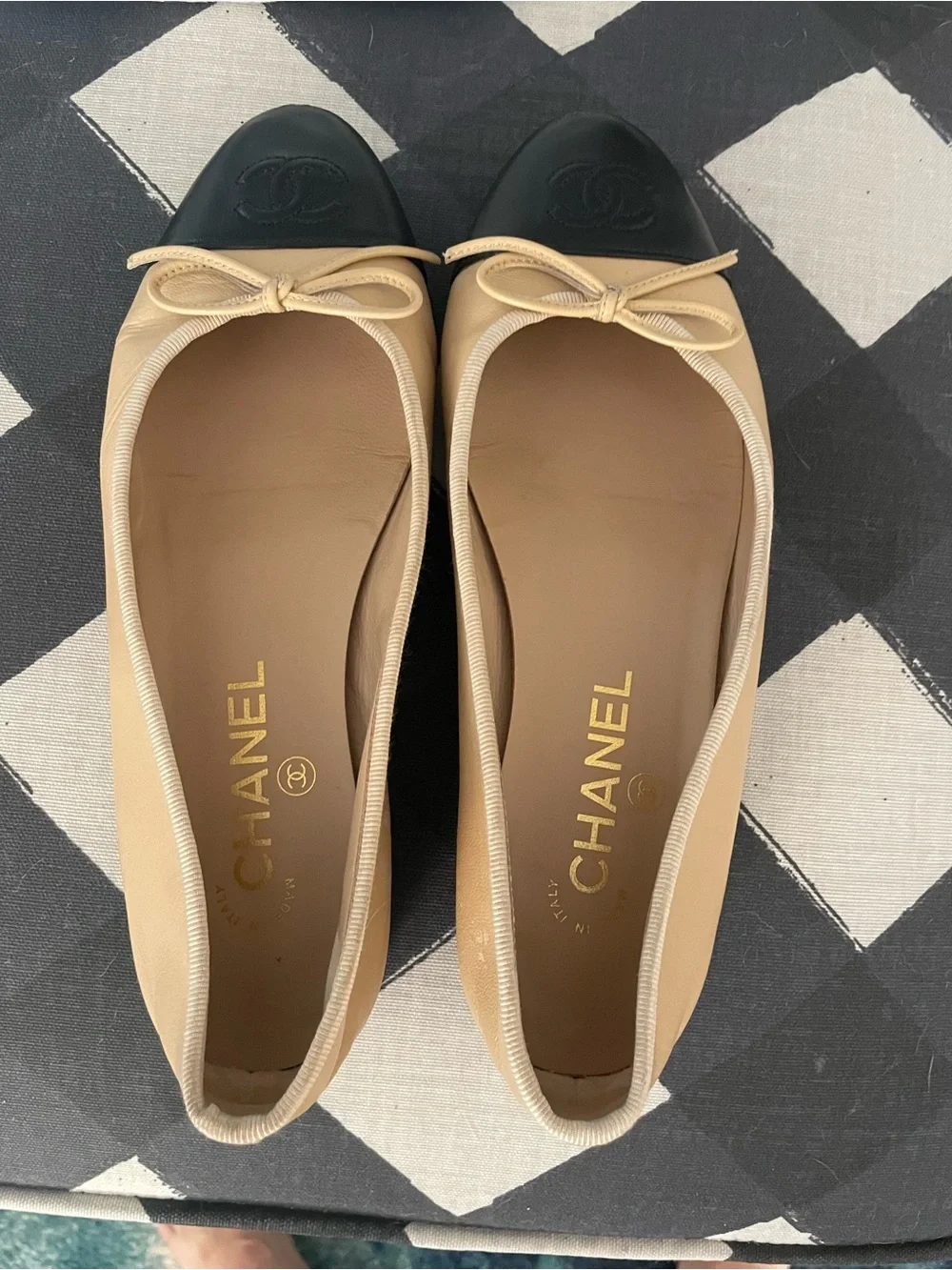 CHANEL Beige Leather Ballet Flats with Black Cap Toe and Bow